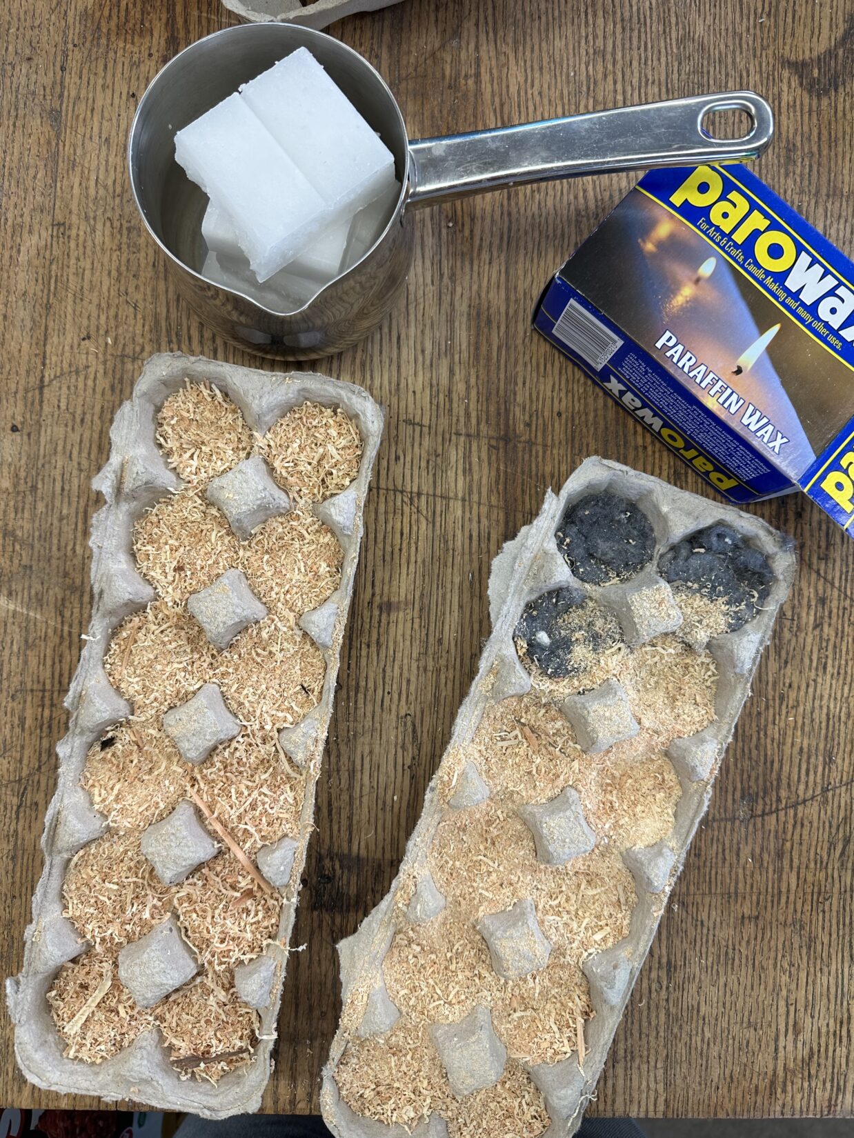 Homemade fire starter with sawdust, paraffin wax, and egg cartons.